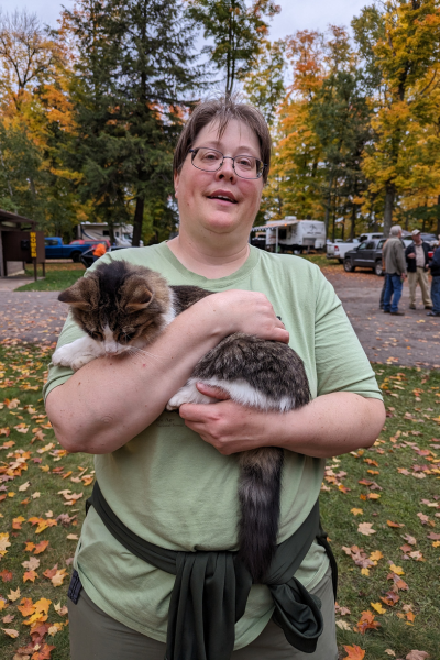 Camp cat "Pizza" enjoys some cuddles at the end of a work day. Photo by Patrick Gleissner.