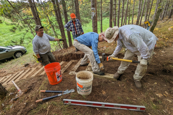 Volunteers work together to build 19 timber steps. Photo by Patrick Gleissner.