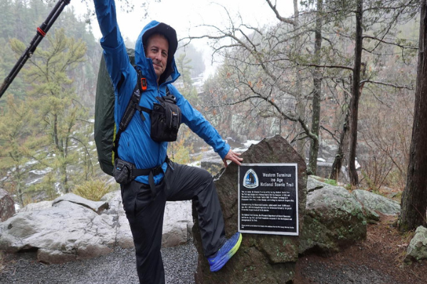 Photo of Morehouse next to the "Western Terminus Ice Age National Scenic Trail" sign at the beginning of his thru-hike. Photo by Dale Morehouse.