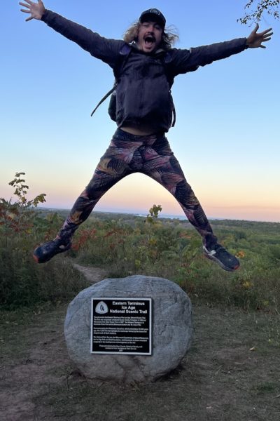 Cole celebrating his thru-hike at the Eastern Terminus. Photo by: Stephanie Lorenz.