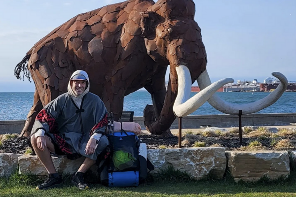 Dosu met Woolly the mammoth at the beginning of his journey in Sturgeon Bay. Photo courtesy of Dosu Kinuta.