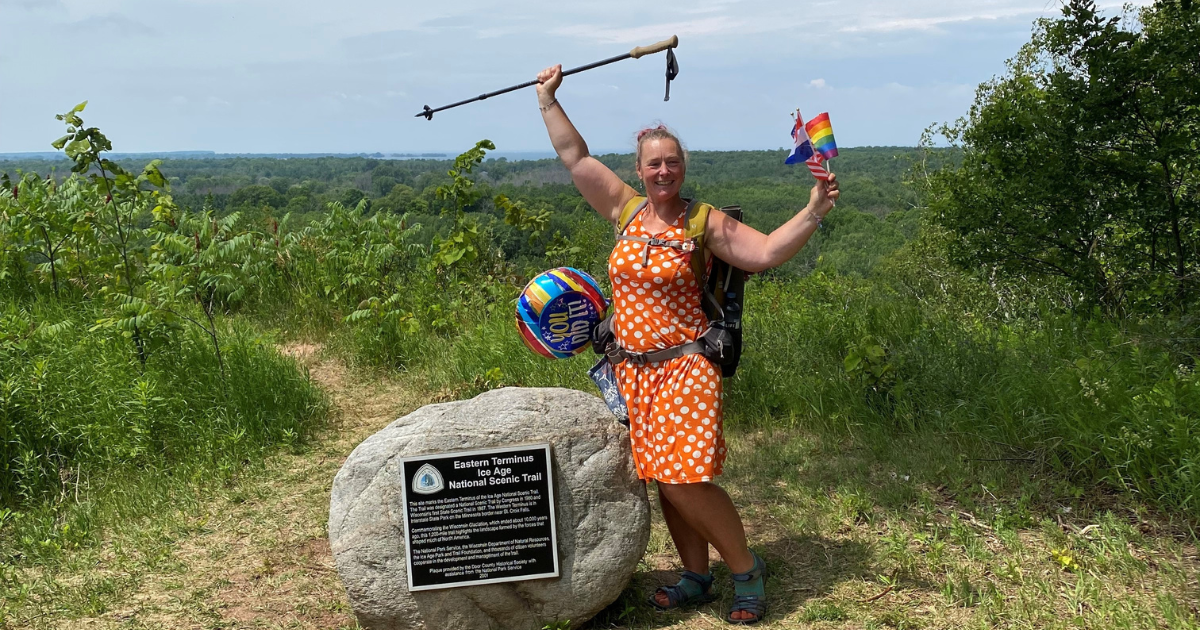 Arlette Laan poses at the Eastern Terminus of the Ice Age National Scenic Trail in Sturgeon Bay, WI at the end of her thru-hike.